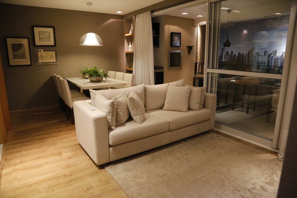 Cozy living room with modern furniture and dining area, perfect for stylish home interiors.